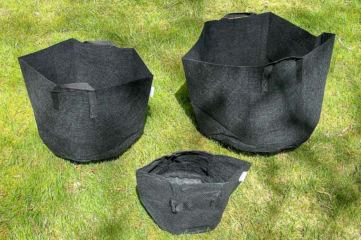 2 gallon, 5 gallon and 10 gallon grow bags on grass