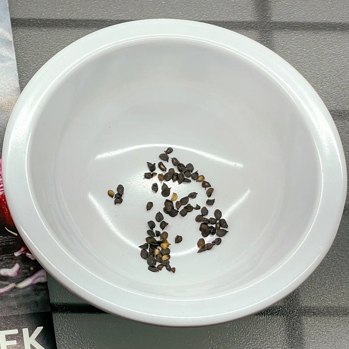 dianthus seeds in small white bowl