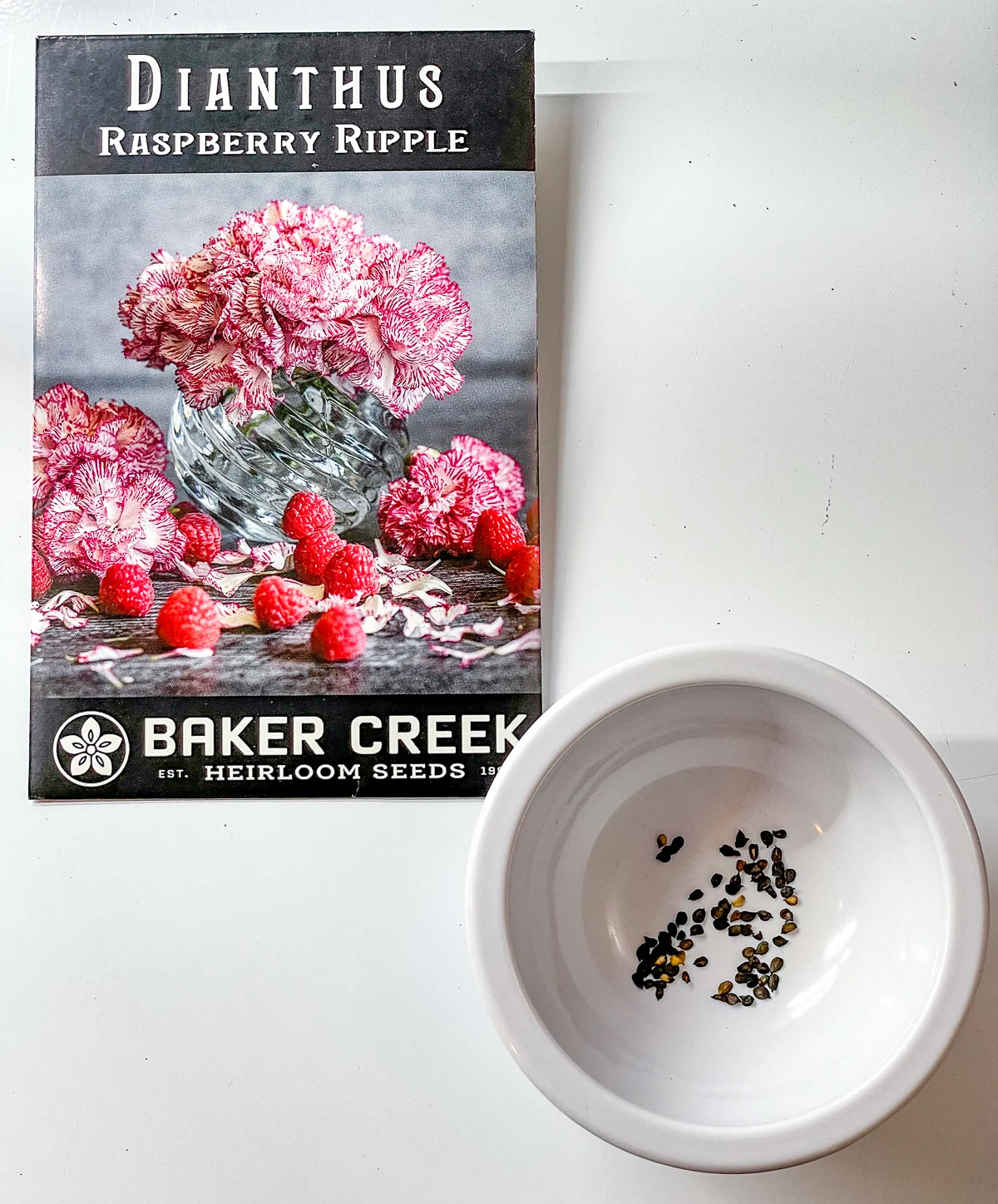 dianthus seed packet and seeds in small bowl