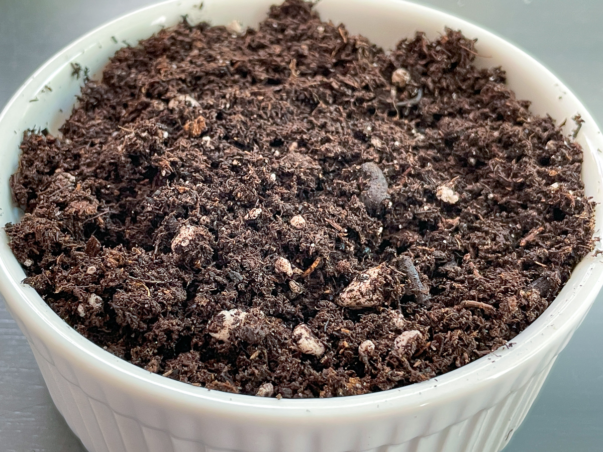 potting soil in white bowl
