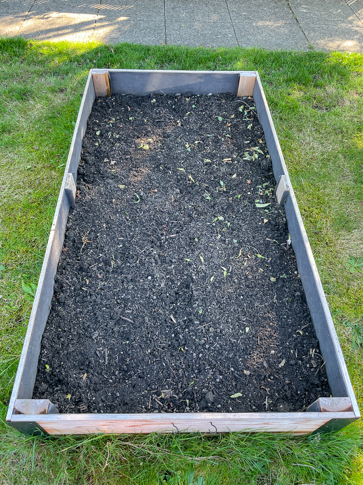 empty raised bed after plants have been pulled out